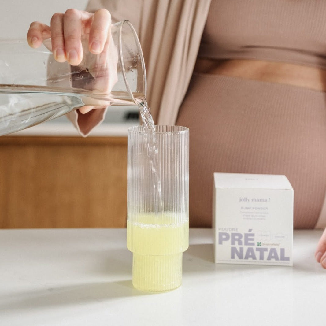 pregnant woman preparing Bump powder pregnancy multivitamin powder